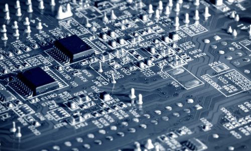 Close-up electronic circuit board with micro chips from a home appliance or laptop electronics and complex devices. Concept of microchips and future technology